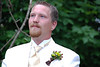 He sees his bride for the first time as she arrives at the wedding site drawn by horse carriage.  He adores her.